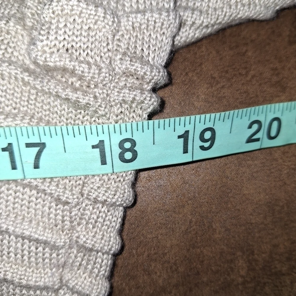 A Calvin Klein faux wrap ribbed knitted sweater dress in a ladies size medium.